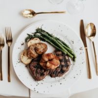 Maplewood Bacon Wrapped Prawns with Twin Filets, Asparagus, Herb Roasted Yukon Potatoes- Emerald Image
