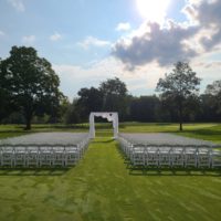 Ceremony Setup with White Resin Chairs